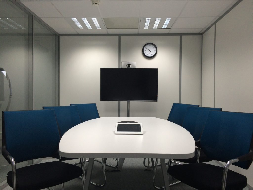 Conference room with a wall-mounted TV screen